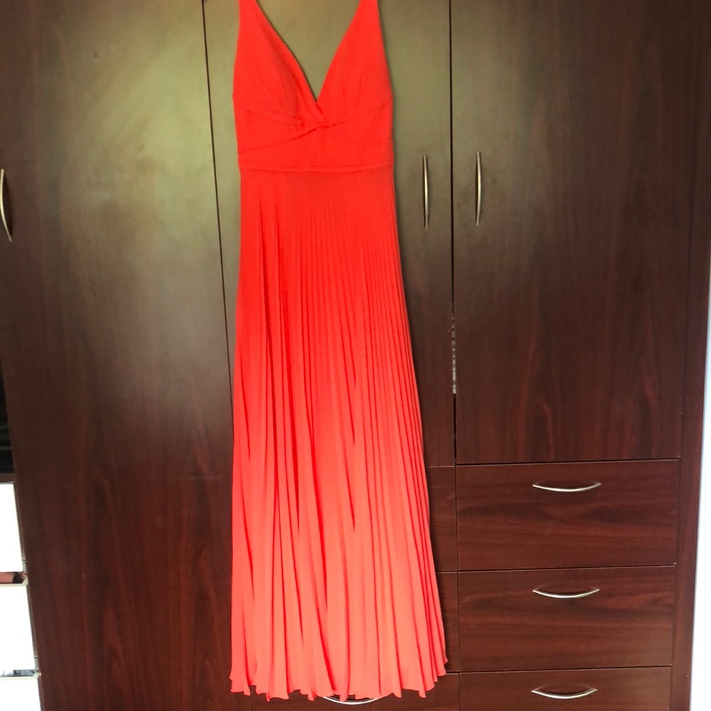 Coral open back pleated dress